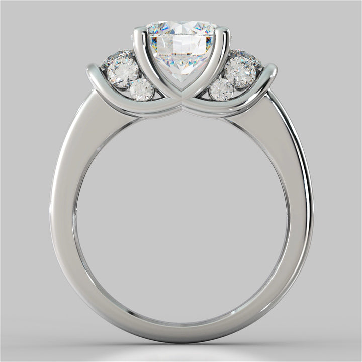 Silver ring with a heart-shaped center stone and round side stones on a gray background
