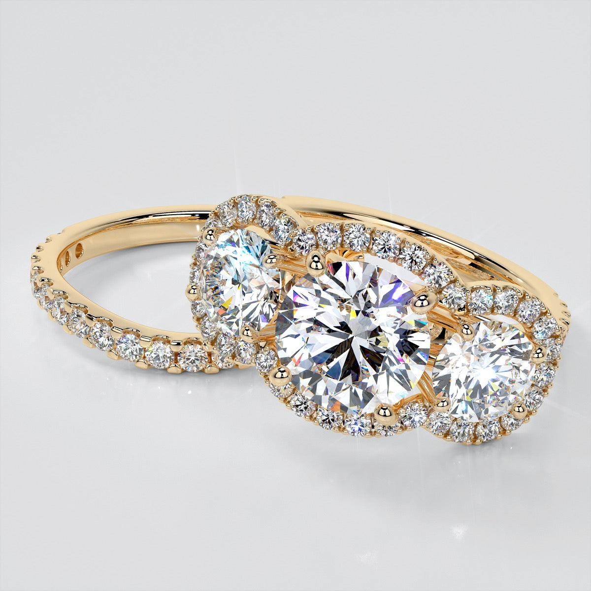 Round Cut Three-Stone Trellis Engagement Ring with Accents