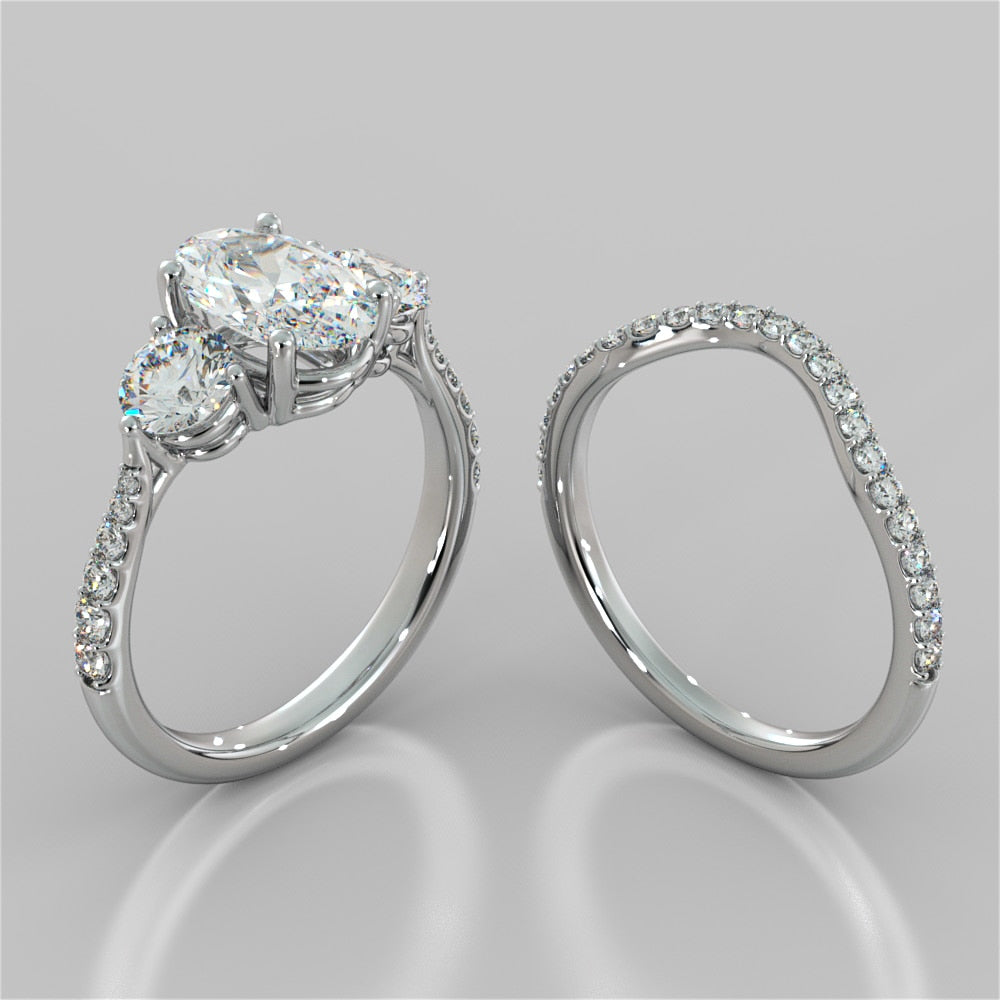 Oval Cut Three-Stone Engagement Ring With Accents