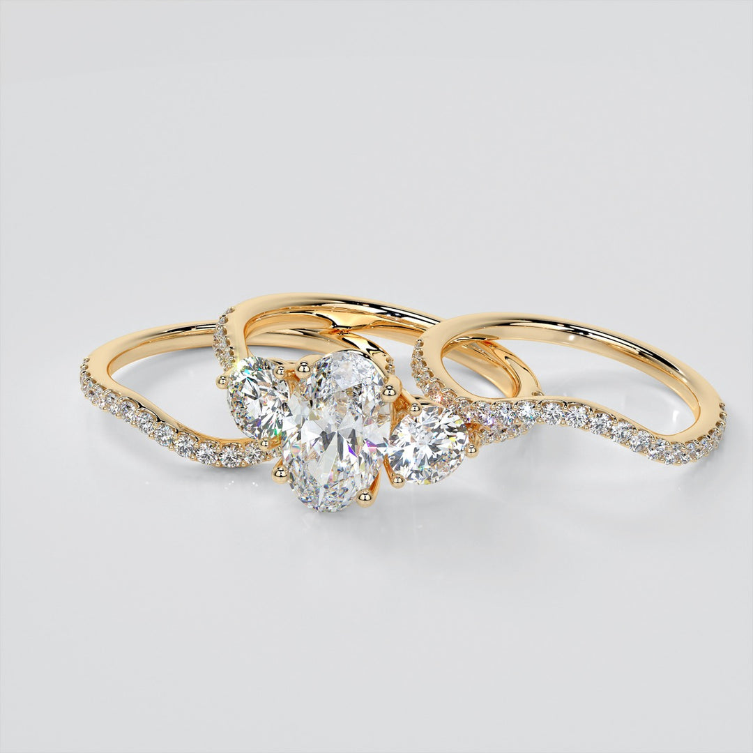 Oval Cut Three-Stone Engagement Ring With Accents
