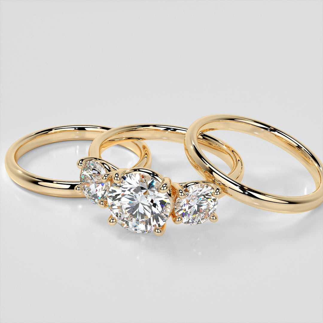 Round Cut Three-Stone Engagement Ring With Accents