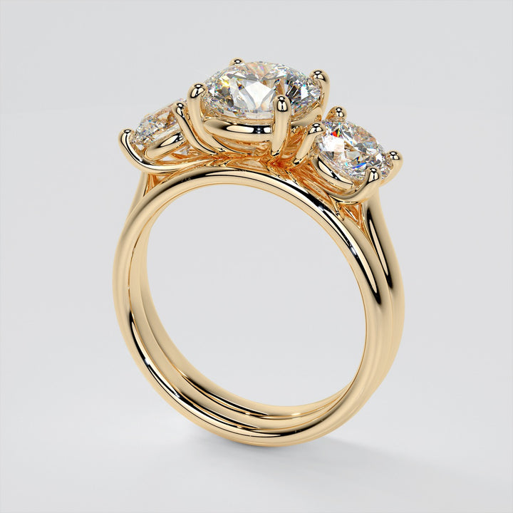 Round Cut Three-Stone Engagement Ring With Accents