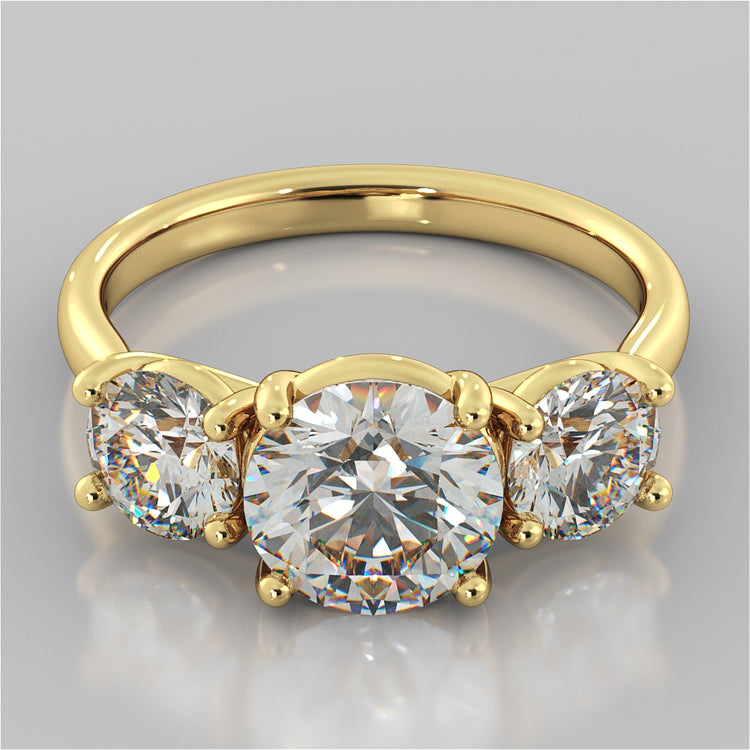 Round Cut Three-Stone Engagement Ring With Accents