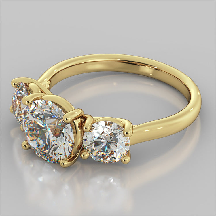 Round Cut Three-Stone Engagement Ring With Accents