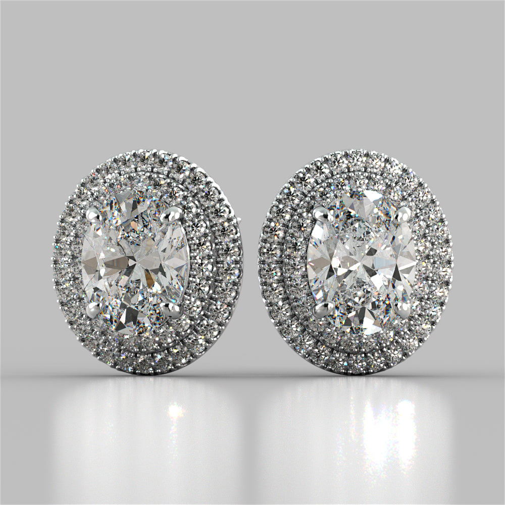 Pair of diamond earrings on a gray background