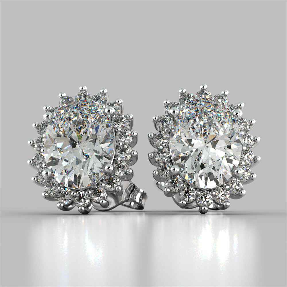 Pair of diamond earrings on a gray background