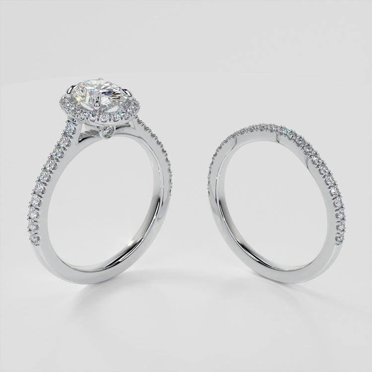 Oval Cut Halo Style Trio Wedding Set With Accents