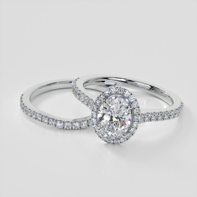 Oval Cut Halo Style Trio Wedding Set With Accents