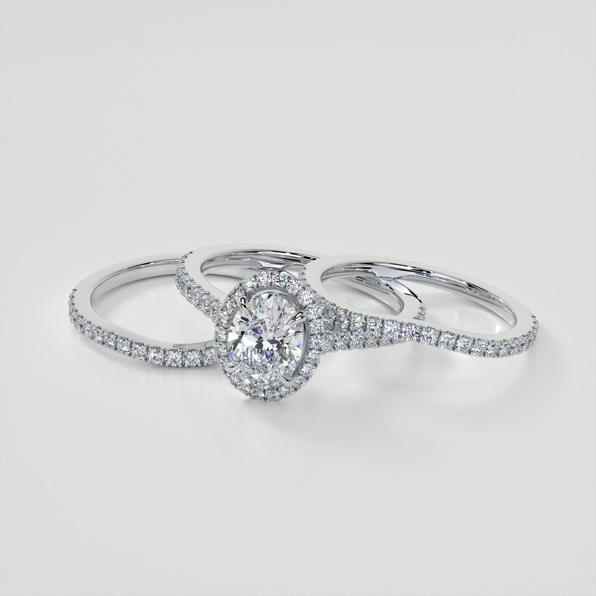 Oval Cut Halo Style Trio Wedding Set With Accents