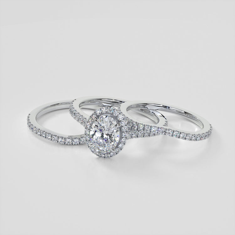 Oval Cut Halo Style Trio Wedding Set With Accents