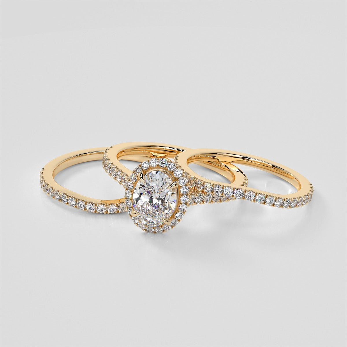 Oval Cut Halo Style Trio Wedding Set With Accents