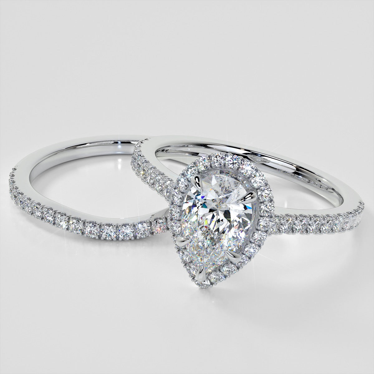 Pear Cut Halo Engagement Ring With Accents
