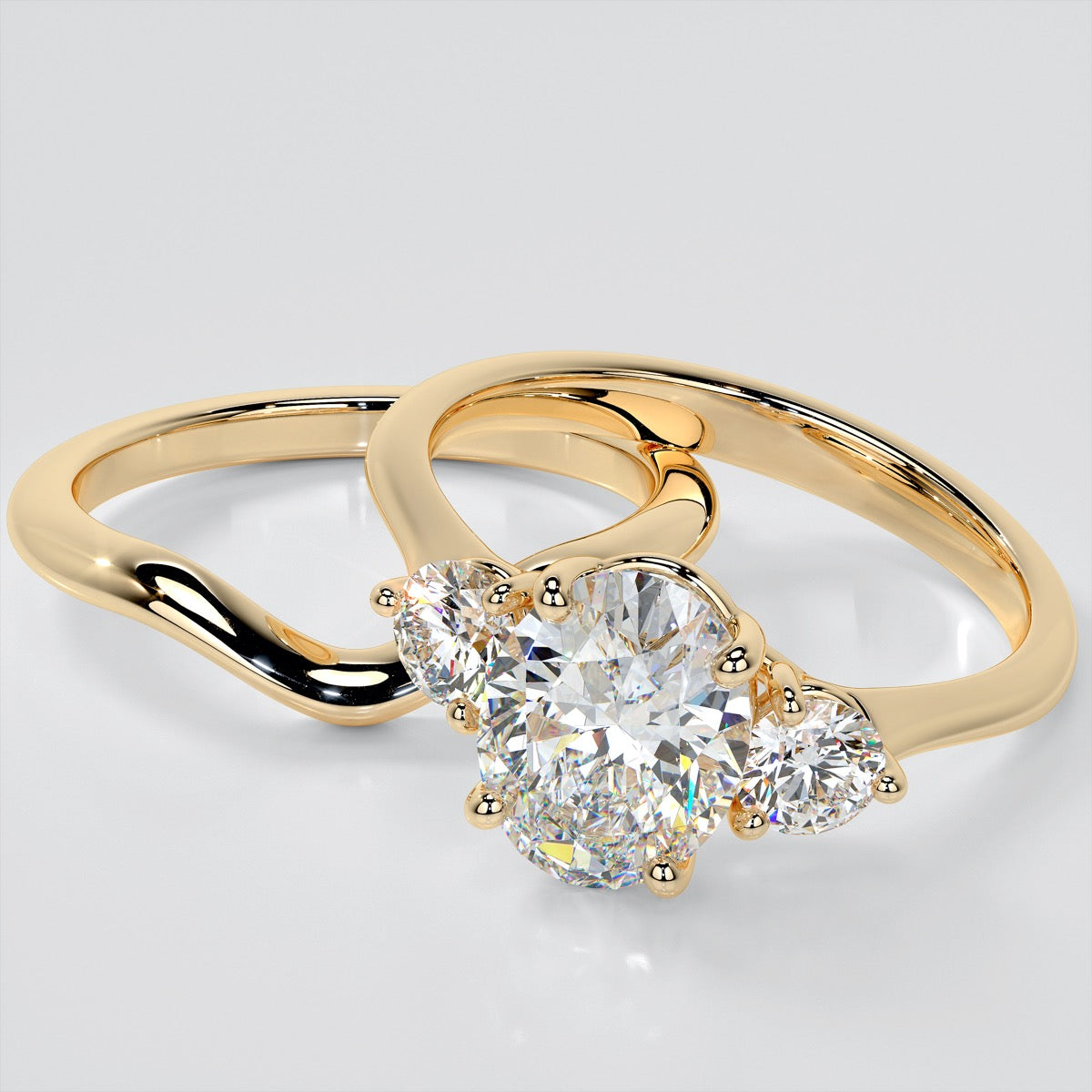 Oval Cut Three-Stone Trio Wedding Set
