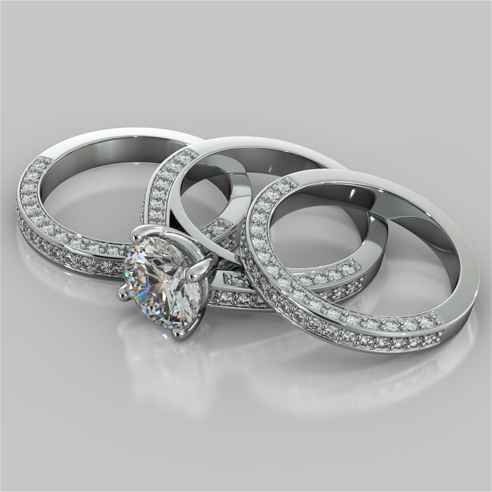 Round Cut Cathedral Engagement Ring with Channel Set Accents