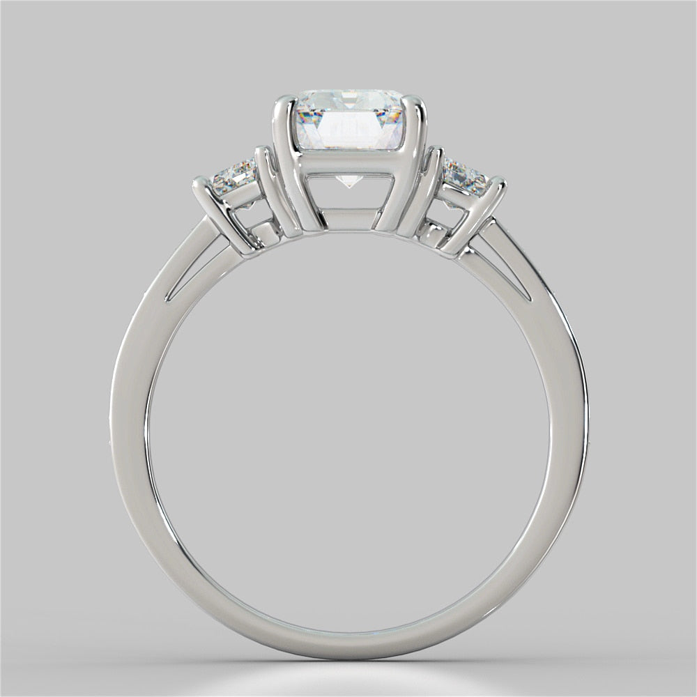 Lab Grown Diamond Emerald Cut Three-Stone Engagement Ring With Trapezoid Accents