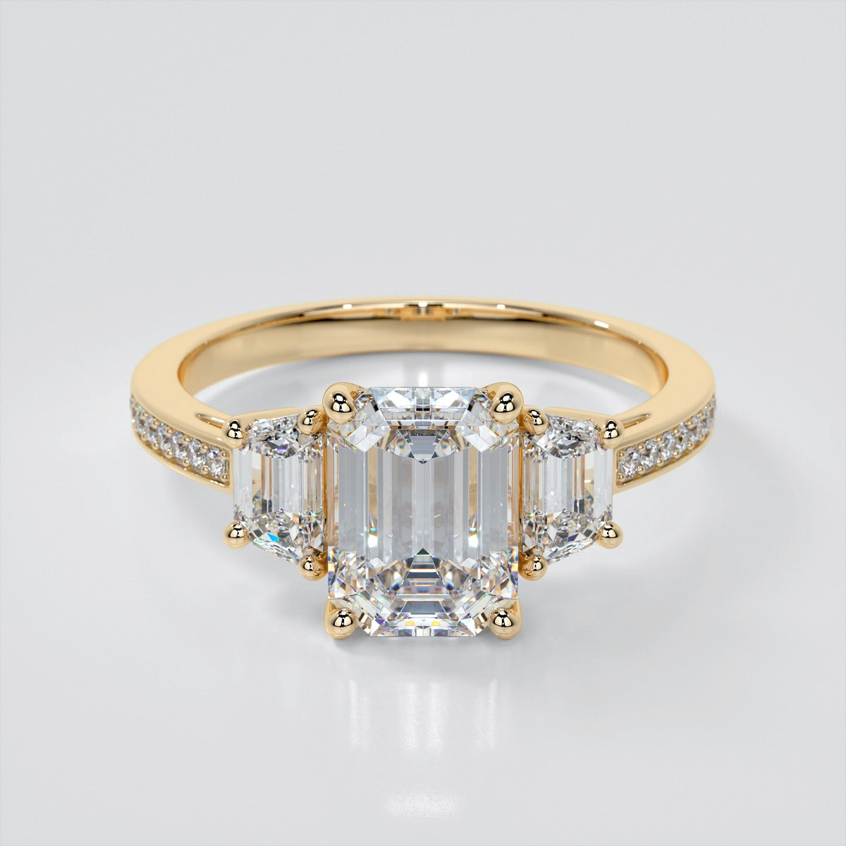 Lab Grown Diamond Emerald Cut Three-Stone Engagement Ring With Trapezoid Accents
