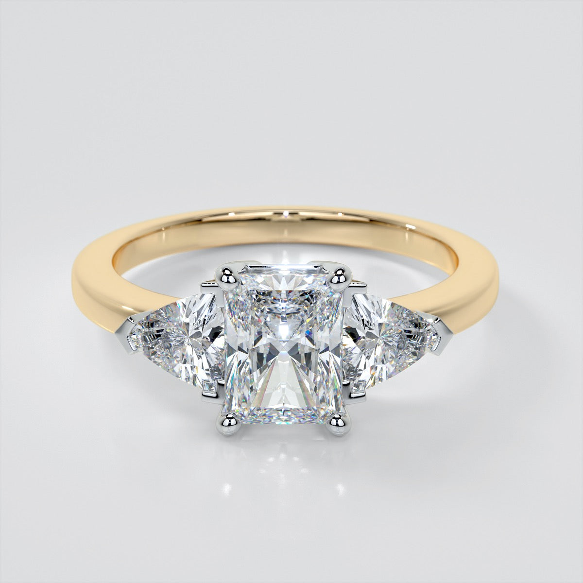 Radiant Cut Three-Stone Engagement Ring With Trillion Accents