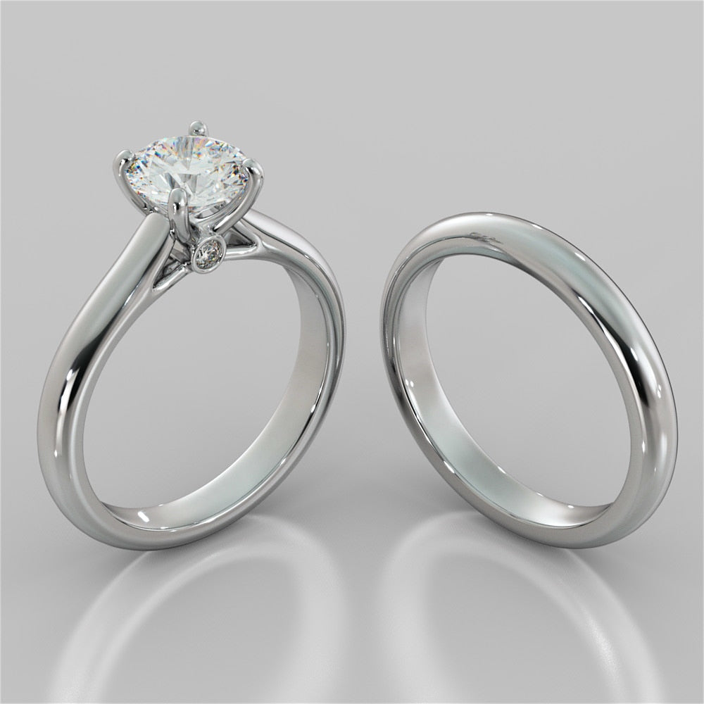 Round Cut Cathedral Engagement Ring With Accents