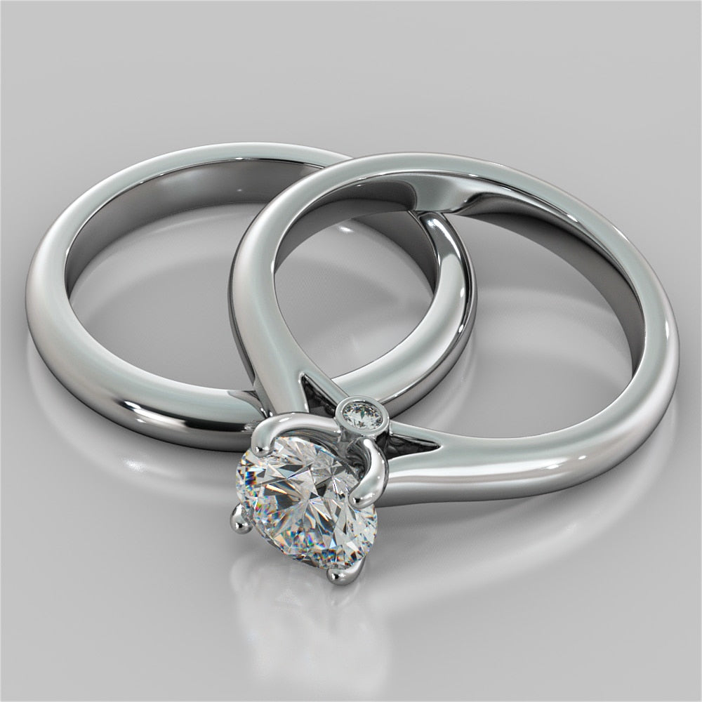 Round Cut Cathedral Engagement Ring With Accents