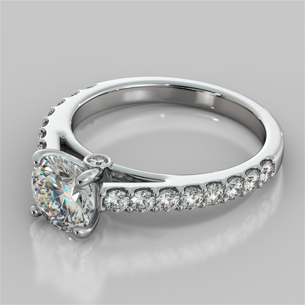 Round Cut Cathedral Style Engagement Ring With Side Accents