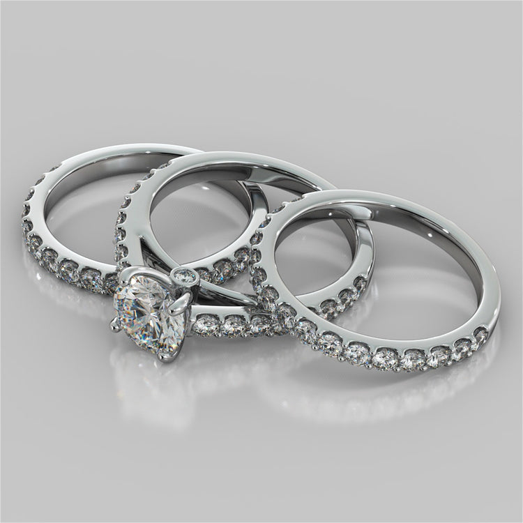 Round Cut Cathedral Style Engagement Ring With Side Accents