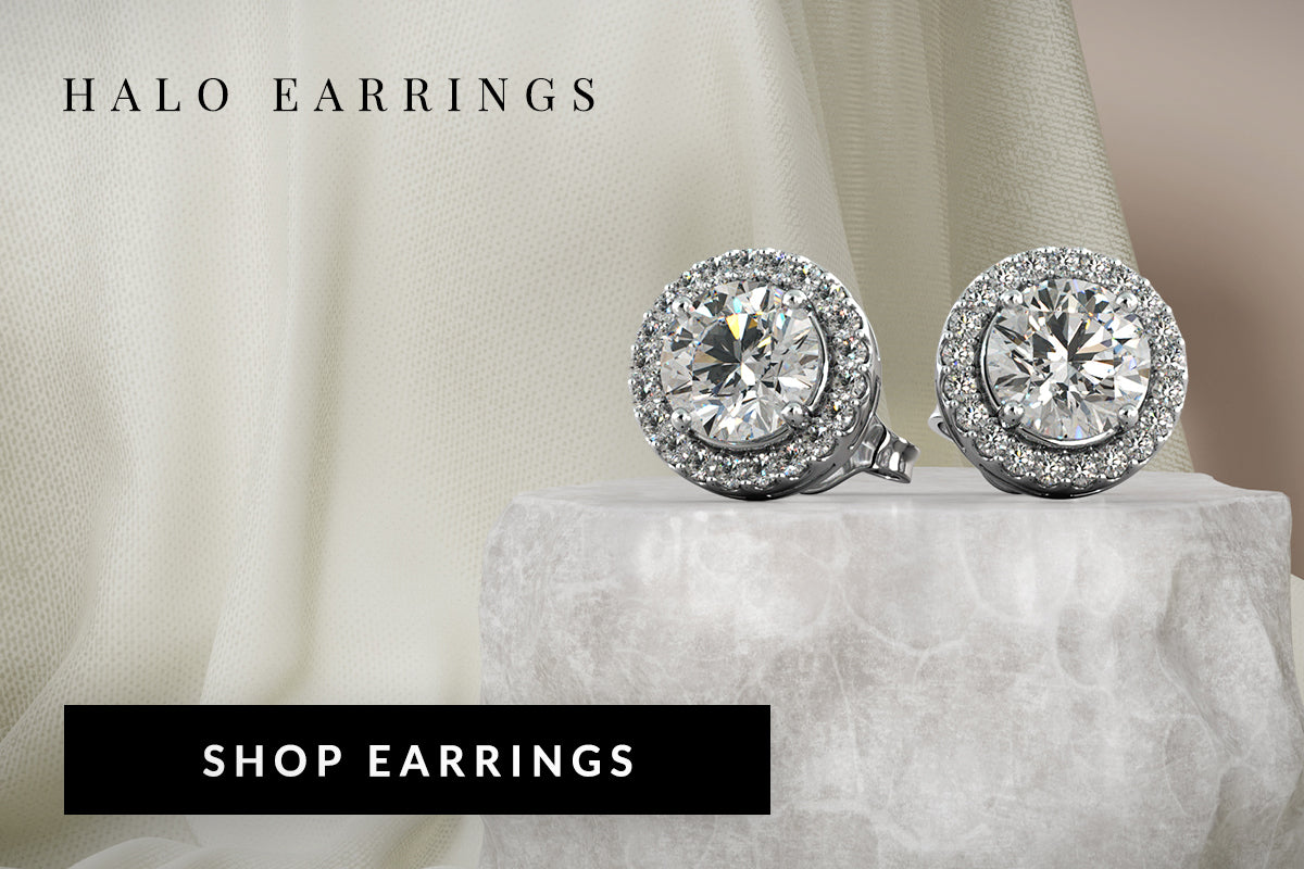 Halo earrings on a white surface with a soft background