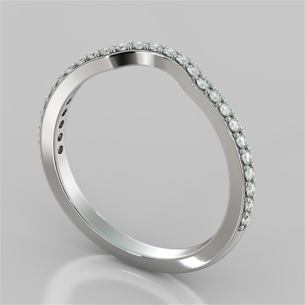 Silver ring with small diamonds on a gray background