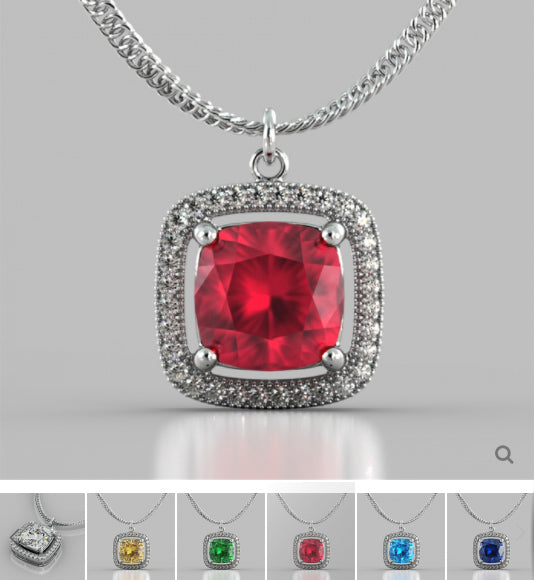 Silver necklace with a red gemstone pendant on a gray background