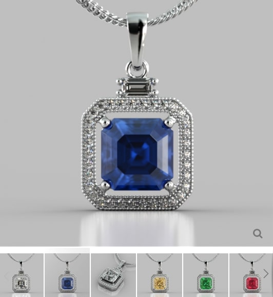 Silver pendant with a blue gemstone on a gray background