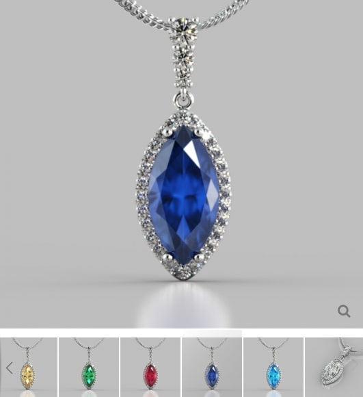 Blue teardrop pendant with silver frame on a gray background