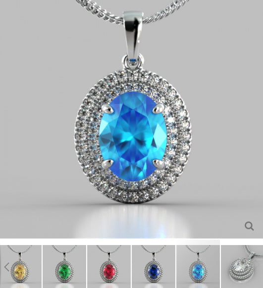 Silver pendant with a blue gemstone on a gray background