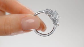 Oval Cut Three-Stone Engagement Ring With Accents