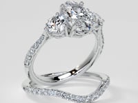 Oval Cut Three-Stone Engagement Ring With Accents