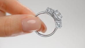 Round Cut Three-Stone Engagement Ring With Accents