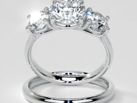 Round Cut Three-Stone Engagement Ring With Accents