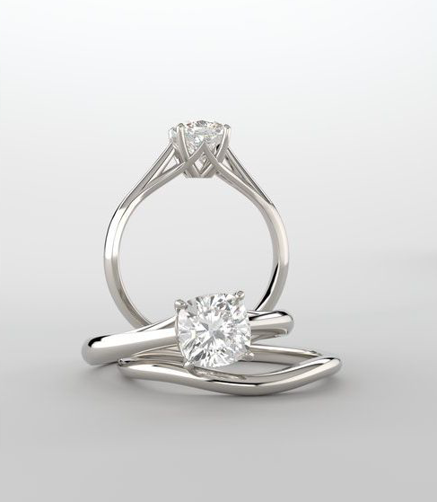 Silver ring with a diamond on a light gray background