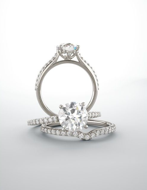 Pair of diamond rings on a light gray background