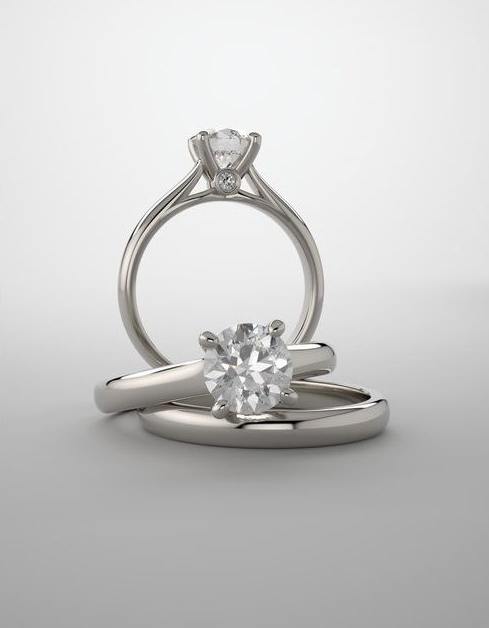 Two diamond rings on a light gray background