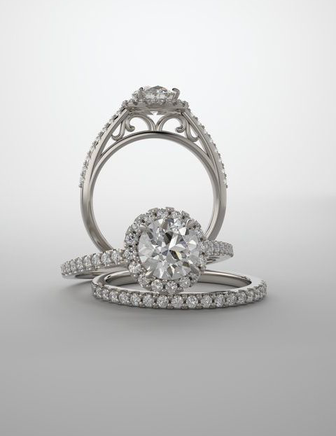 Diamond ring with intricate design on a light gray background