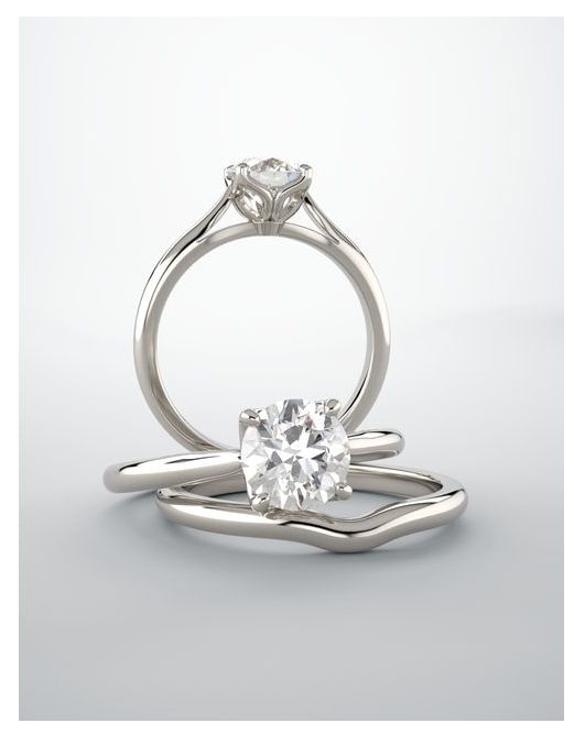 Silver ring with two diamond stones on a light gray background