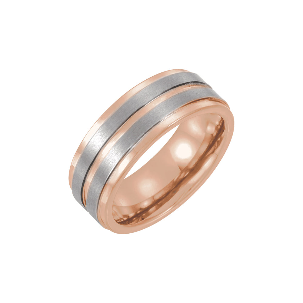 Two-tone rose gold and silver ring on a white background